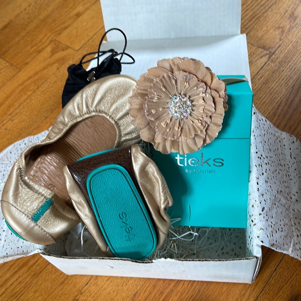 Tieks size 8 champagne gold.  Worn once, all packaging is included